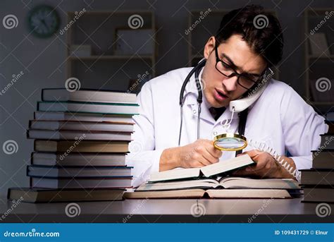 The Medical Student Preparing for University Exams at Night Stock Image ...