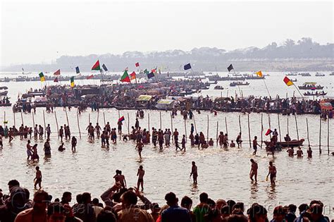 boats and hindu pilgrim bathing in the ganges river at sangam, kumbh ...