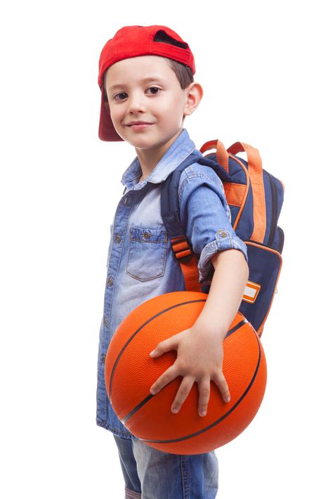 Portrait of a school kid holding a basketball, isolated on white | Chakra Community