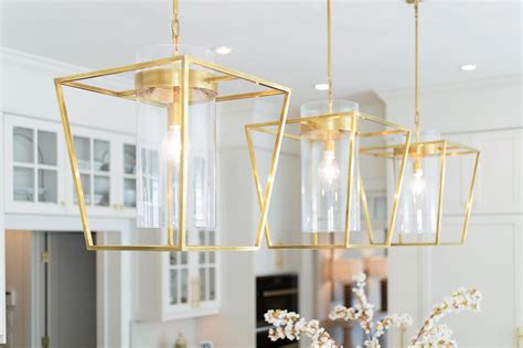Brushed gold pendant lights above kitchen island. | Gold pendant lighting, Kitchen island ...