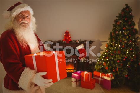 Happy Santa Delivering Presents At Christmas Eve Stock Photo | Royalty-Free | FreeImages