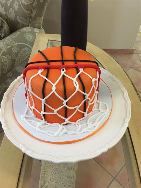 a cake that is decorated with a basketball net