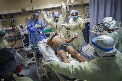 Incredible moment a COVID-19 patient is pulled from the brink of death with a jolt: Photo series ...