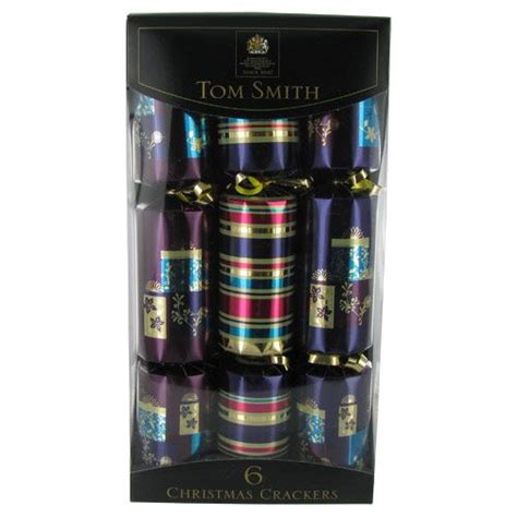 Christmas Crackers are a favorite tradition in England and contain a paper crown, a small ...