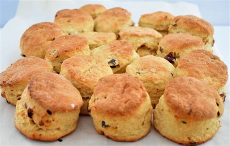 a bunch of biscuits sitting on top of a piece of parchment paper next to each other