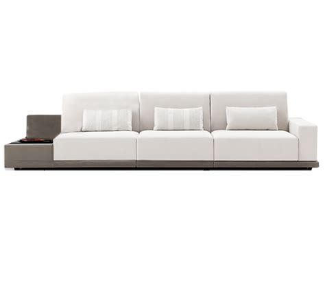 a white couch sitting on top of a wooden table