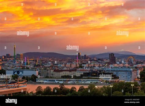 Vienna, fiery sunset at river Donau (Danube), amusement park Prater ...