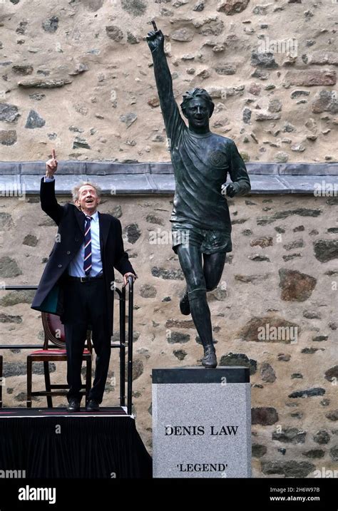 Denis Law poses as he unveils his statue in Marischal Square, Aberdeen ...