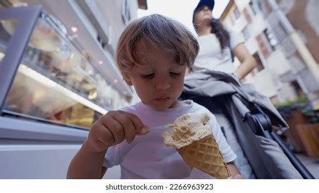 Child Eating Ice Cream Cone Seated Stock Photo 2266498945 | Shutterstock