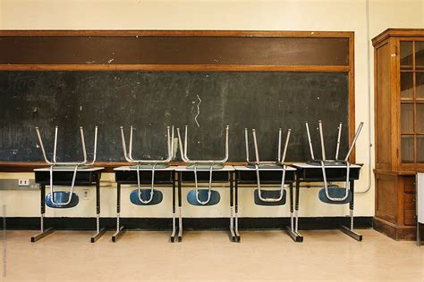 "Empty School Classroom With Chair And Desks" by Stocksy Contributor "Raymond Forbes LLC" - Stocksy