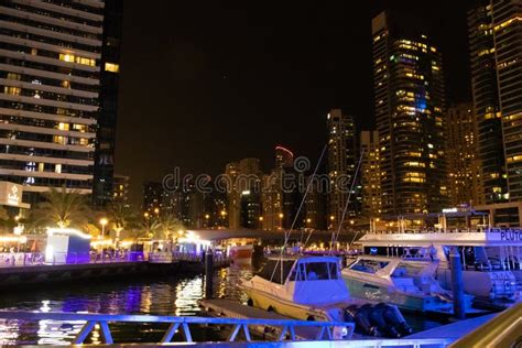 Night View of Dubai Marina Skyscrapers and Luxurious Yachts at Pier UAE ...