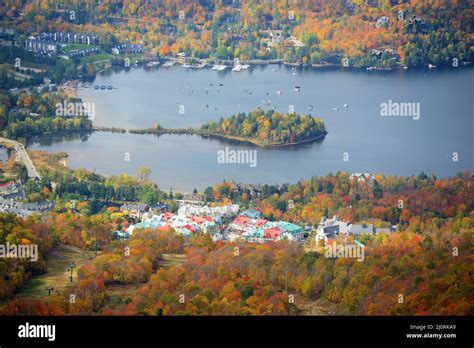 Aerial view of Lake Tremblant and Mont-Tremblant village in fall with fall foliage, from top of ...