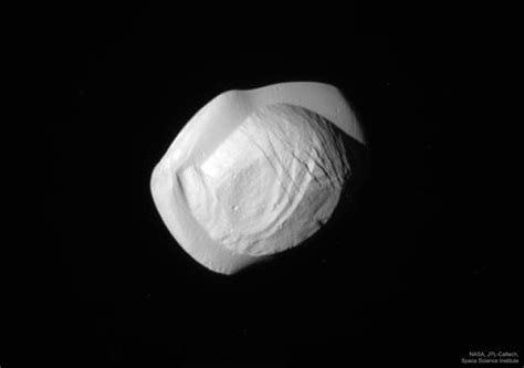 APOD: 2017 March 13 - Saturn's Moon Pan from Cassini