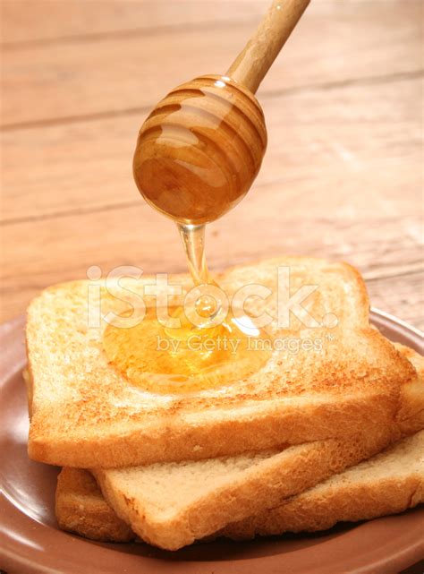 Honey Pouring Over Toast Bread Stock Photo | Royalty-Free | FreeImages