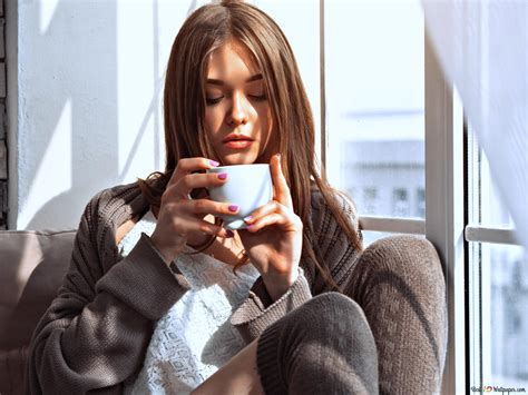 Pretty girl drinking coffee by the window 4K wallpaper download