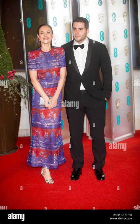 Olga Kurylenko and Ben Cura at the 72nd British Academy Film Awards ...