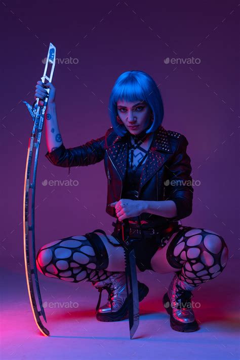 Cyberpunk girl dressed in sexy outfit and jacket Stock Photo by fxquadro