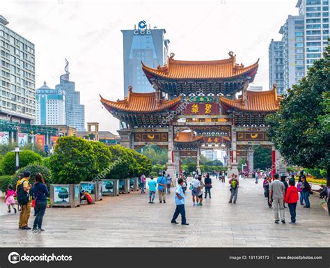 KUNMING, CHINA - SEPTEMBER 9, 2012: Kunming Archway. Traditional chinese gate and modern ...