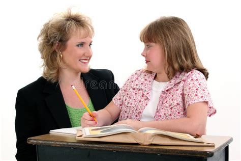 Student And Teacher At Desk Royalty Free Stock Photo - Image: 231525