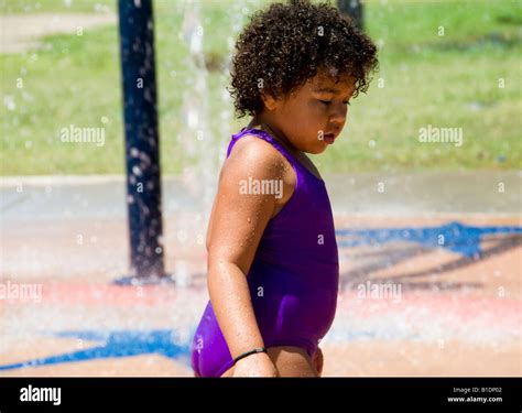 A 3 to 4 year old overweight African-American toddler takes a moment of ...