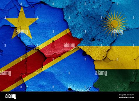 flags of DR Congo and Rwanda painted on cracked wall Stock Photo - Alamy