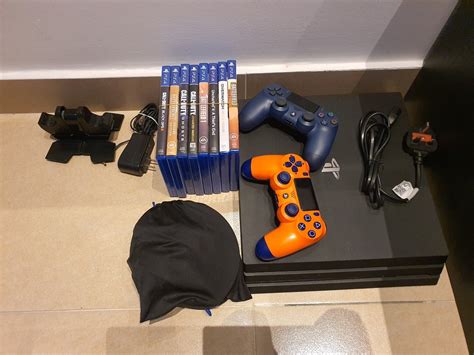 Sony PlayStation 4 Pro with Games & accessories - 248AM Classifieds