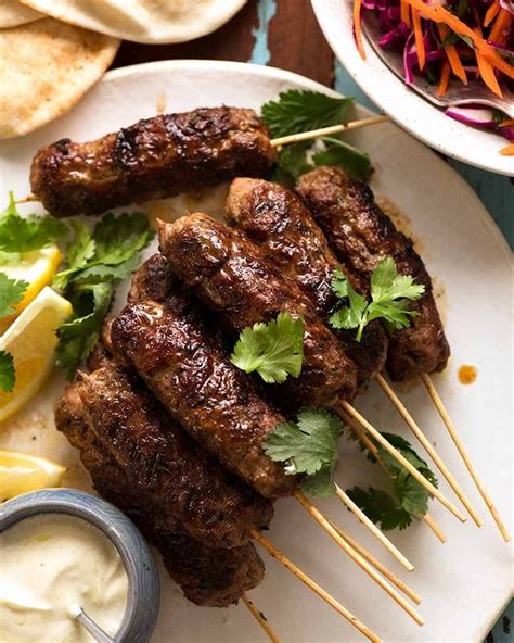 Lamb Koftas on a platter, ready to stuff into pita bread with minted salad and yogurt sauce ...