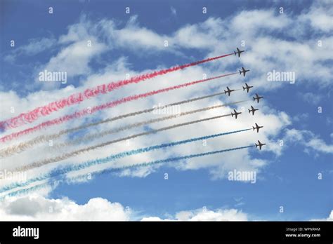 Red Arrows with smoke trails painting the sky red, white and blue ...