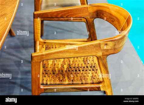 Wooden chair detail in small living room Stock Photo - Alamy