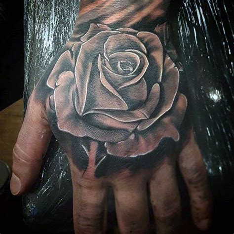 Awesome Black Rose Tattoo On Hand For Men | Rose tattoos for men, Hand ...