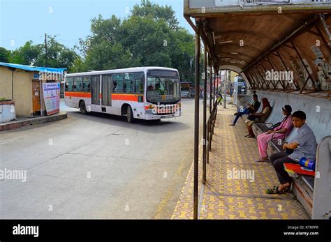 City bus arriving at a bus stop, Pune, Maharashtra Stock Photo - Alamy