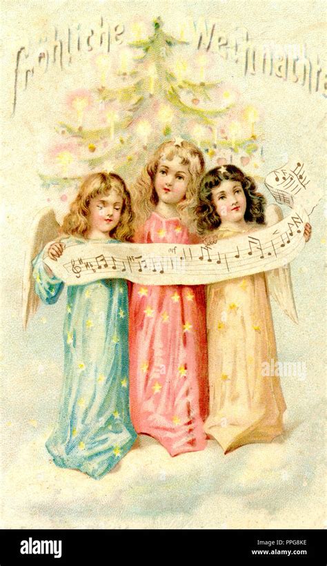 Three Christmas angels singing Stock Photo - Alamy