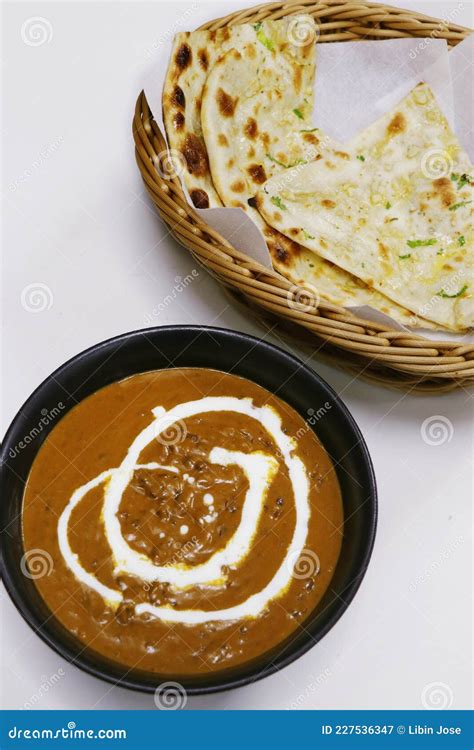 Indian Lentil Curry Known As Dal Makhani with Tandoori Naan Bread Stock Image - Image of bowl ...