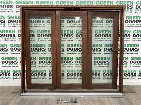 Wooden Hardwood Varnished Bi-folding Doors | Green doors