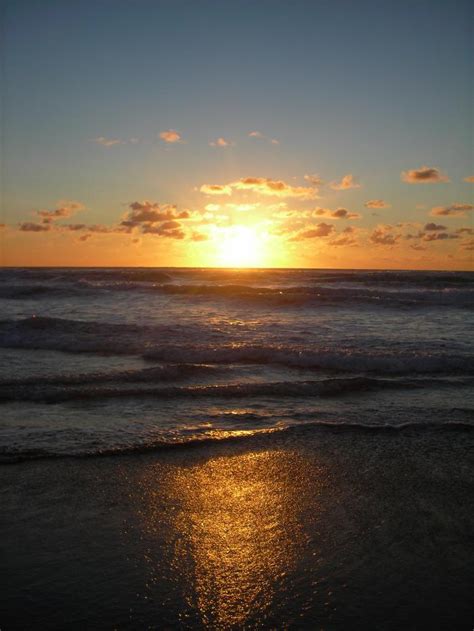 Sunsets at Muriwai Beach - Photo of Auckland New Zealand at KiwiWise