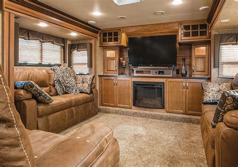 The latest trend in fifth-wheels brings the lounge upstairs | Rv living room, Luxury rv living ...