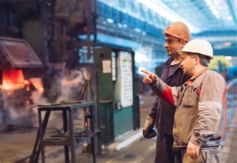 Premium Photo | Workers in the steel mill.