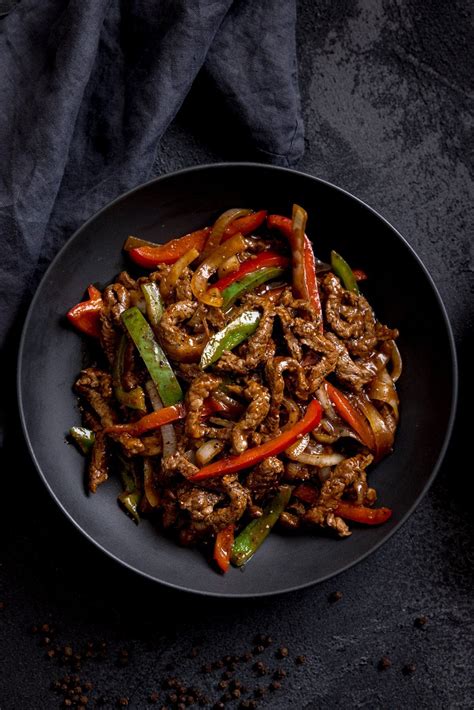 Tender strips of steak, stir fried in a warming black pepper sauce with peppers and onions. This ...