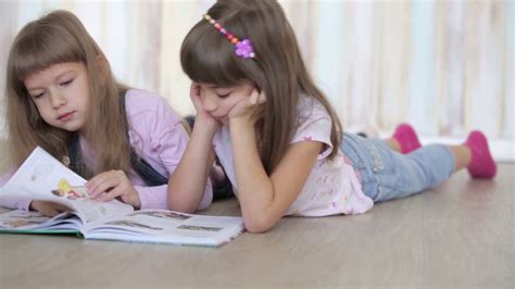 Two Children Reading Book On Floor Stock Footage SBV-310035565 - Storyblocks