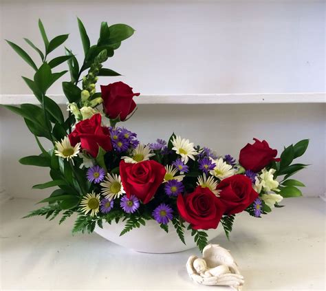 One of our unique Crescent arrangements available at Edwards Flowerland ...