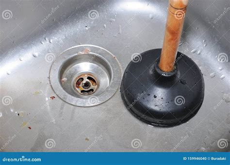 Plunger and kitchen sink stock photo. Image of faucet - 159946040