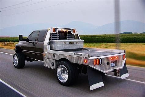 Lifted 2nd gen Ram club cab flatbed dually work rig | Custom trucks ...