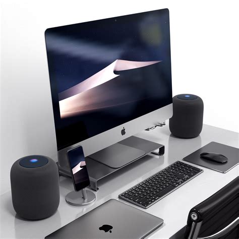 an apple desktop computer sitting on top of a desk next to a keyboard and mouse