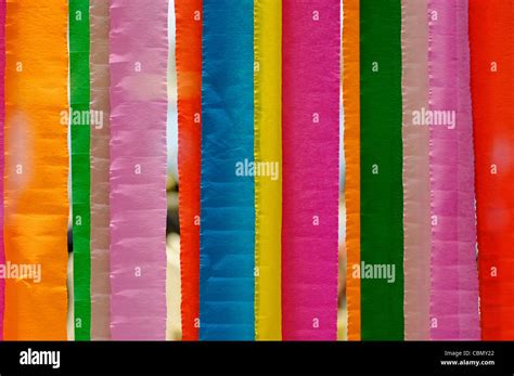 Multi coloured strips of paper form their own rainbow Stock Photo - Alamy