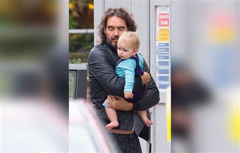 Russell Brand Shows Off His Sweet Side, Cradles Baby Girl During Family ...