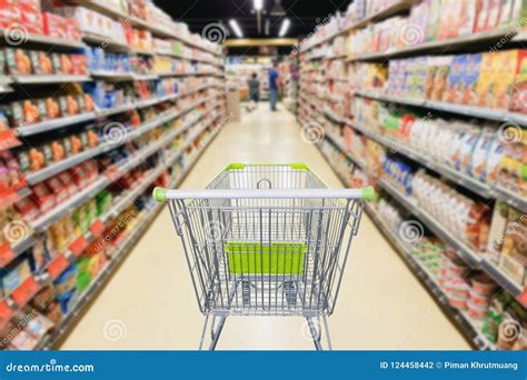 Supermarket Aisle with Empty Shopping Cart at Grocery Store Stock Photo ...