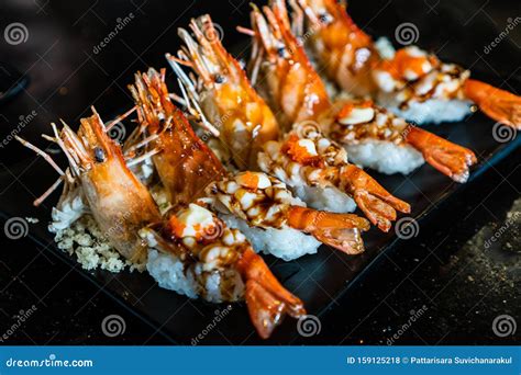 Ebi Shrimp Nigiri Sushi on Black Ceramic Plate in Japanese Restaurant ...