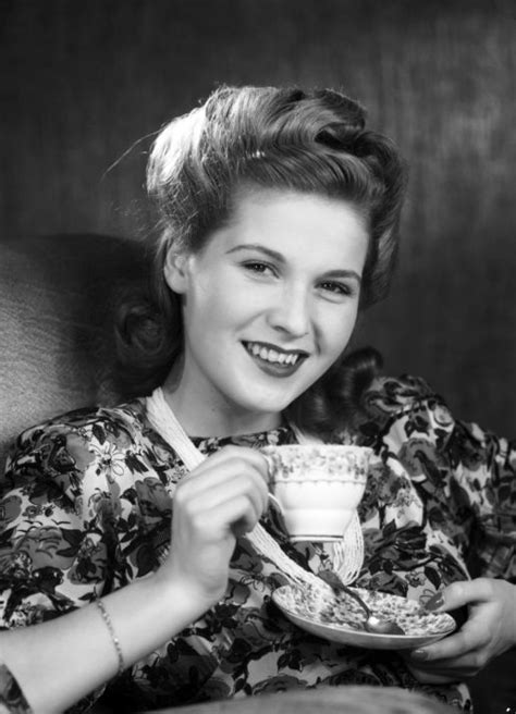 A woman drinking tea | 1950 | #vintage #1950s #hair #makeup | 1950s hair and makeup, Short ...