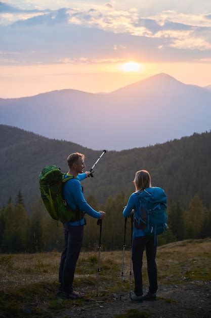 Free Photo | Summer mountain trekking Two travelers hiking in the mountains