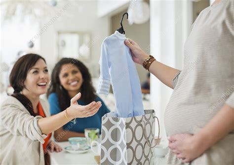 Pregnant woman having baby shower - Stock Image - F013/8273 - Science Photo Library